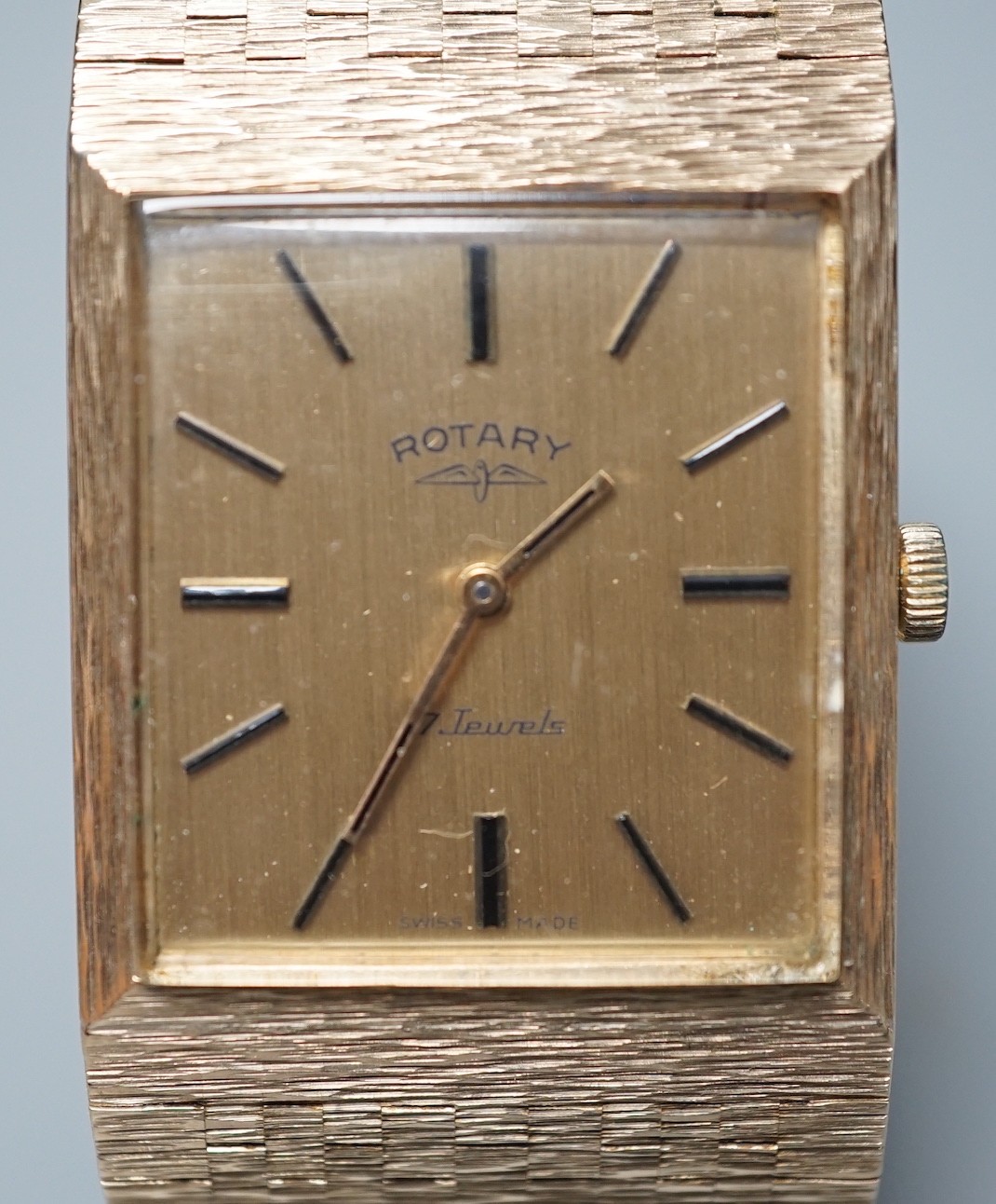 A gentleman's early 1970's textured 9ct gold Rotary manual wind dress wrist watch, with baton numerals, gross weight 67 grams, with Rotary box.